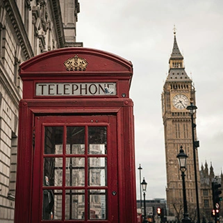A red telephone box outside the houses of parliament